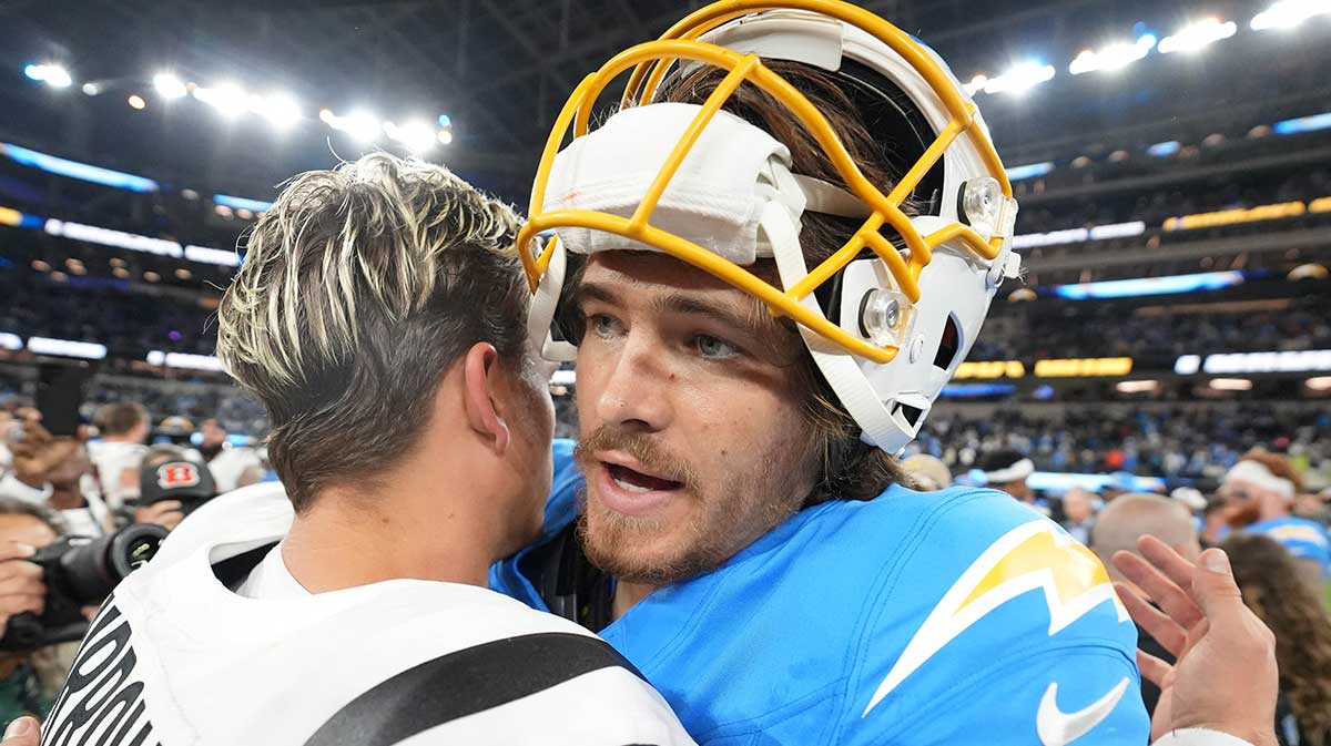 Joe Burrow and Justin Herbert embracing after Bengals-Chargers game.