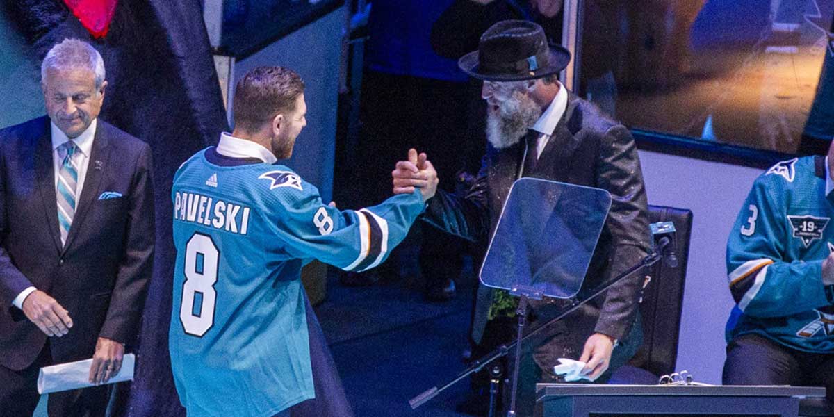 San Jose Sharks former player Joe Pavelski greets Joe Thornton during the Joe Thornton retirement ceremony at SAP Center in San Jose.