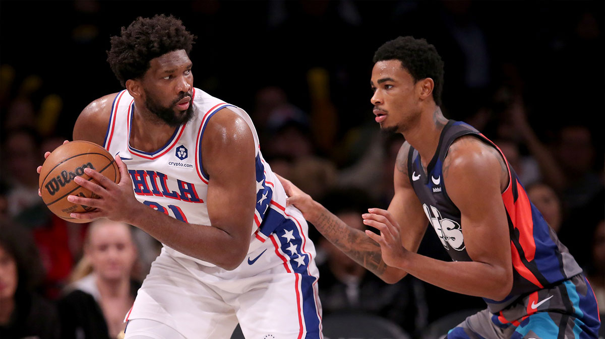 Nov 19, 2023; Brooklyn, New York, USA; Philadelphia 76ers center Joel Embiid (21) controls the ball against Brooklyn Nets center Nic Claxton (33) during the third quarter at Barclays Center. Mandatory Credit: Brad Penner-Imagn Images