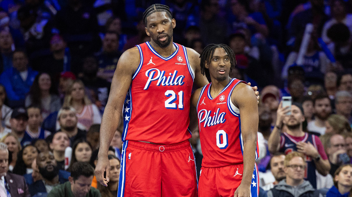 Philadelphia 76ers center Joel Embiid (21) and guard Tyrese Maxey (0) stand together during a break in action in the fourth quarter against the Orlando Magic at Wells Fargo Center.