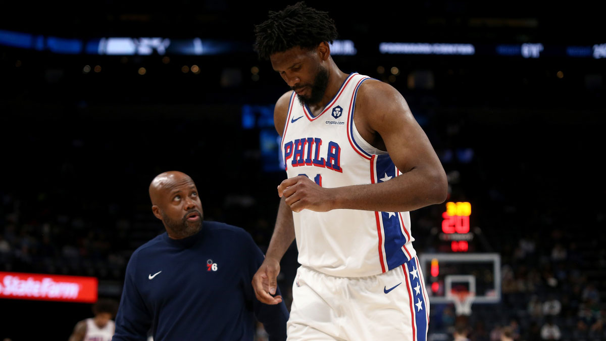 Philadelphia 76ers center Joel Embiid (21) limps to the bench during a time out during the second half against the Memphis Grizzlies at FedExForum.