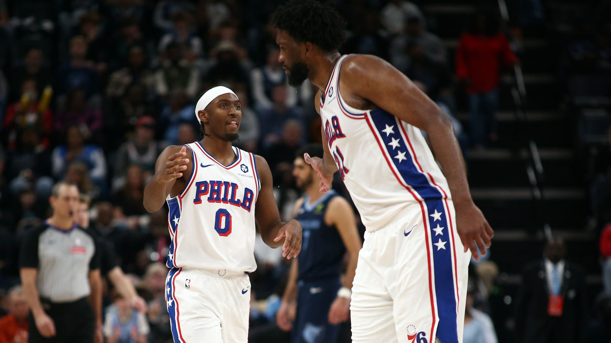 Philadelphia 76ers guard Tyrese Maxey (0) and center Joel Embiid (21) react during the second half against the Memphis Grizzlies at FedExForum. 