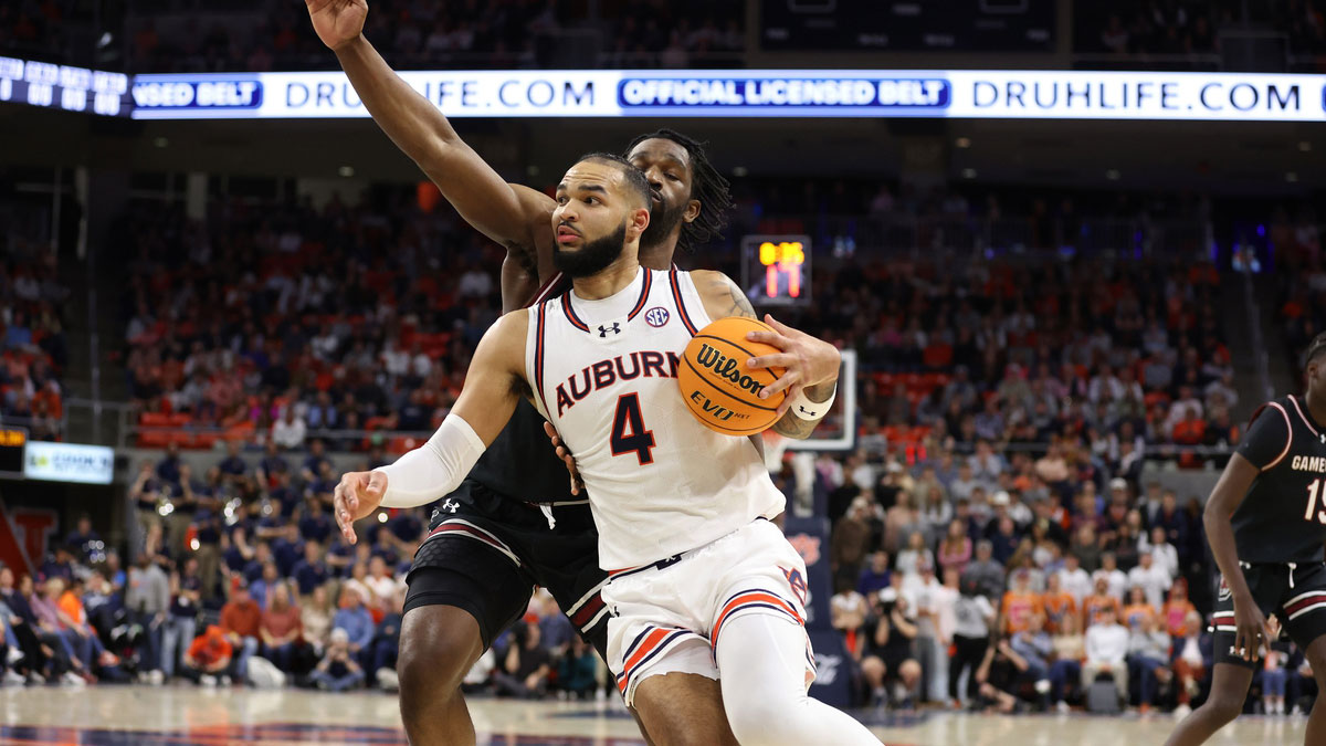 Auburn Tigers forward Johni Broome (4) gets past South Carolina Gamecocks forward Josh Gray (33) for a shot during the second half at Neville Arena.