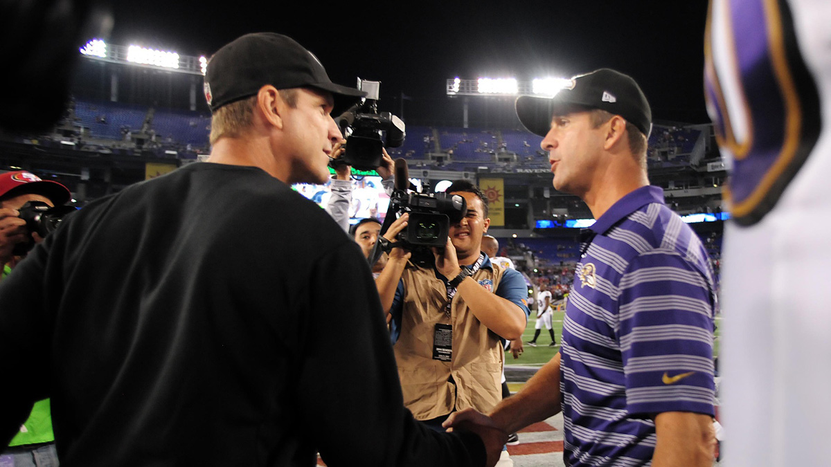 San Francisco 49ers head coach Jim Harbaugh (left) shakes hands with Baltimore Ravens head coach John Harbaugh (right) after the game at M&T Bank Stadium. 