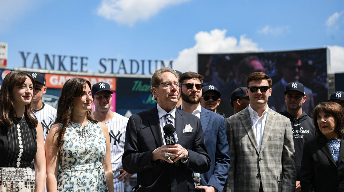 Longtime Yankee announcer John Sterling is honored during a pregame ceremony in recognition of his retirement before a game against the Toronto Blue Jays at Yankee Stadium.