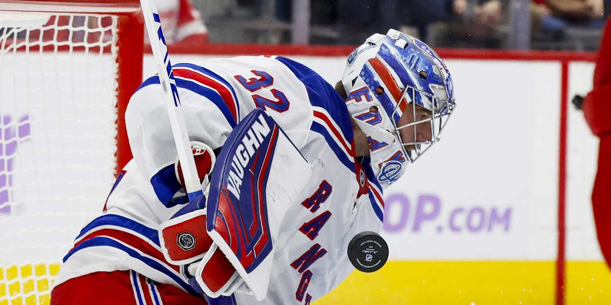 New York Rangers goaltender Jonathan Quick (32) makes a save against the Detroit Red Wings in the second period at Little Caesars Arena.