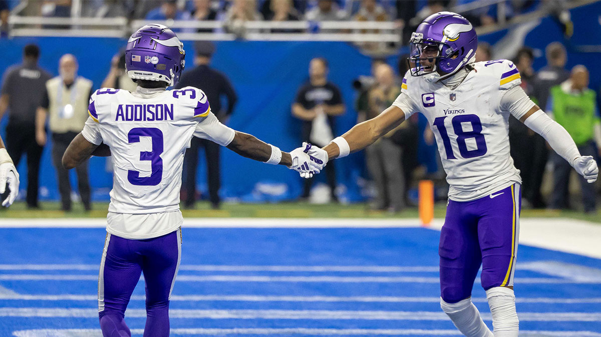 Minnesota Vikings wide receiver Jordan Addison (3) catches a pass for a touchdown and celebrates with wide receiver Justin Jefferson (18) during second half of the game against the Detroit Lions at Ford Field.