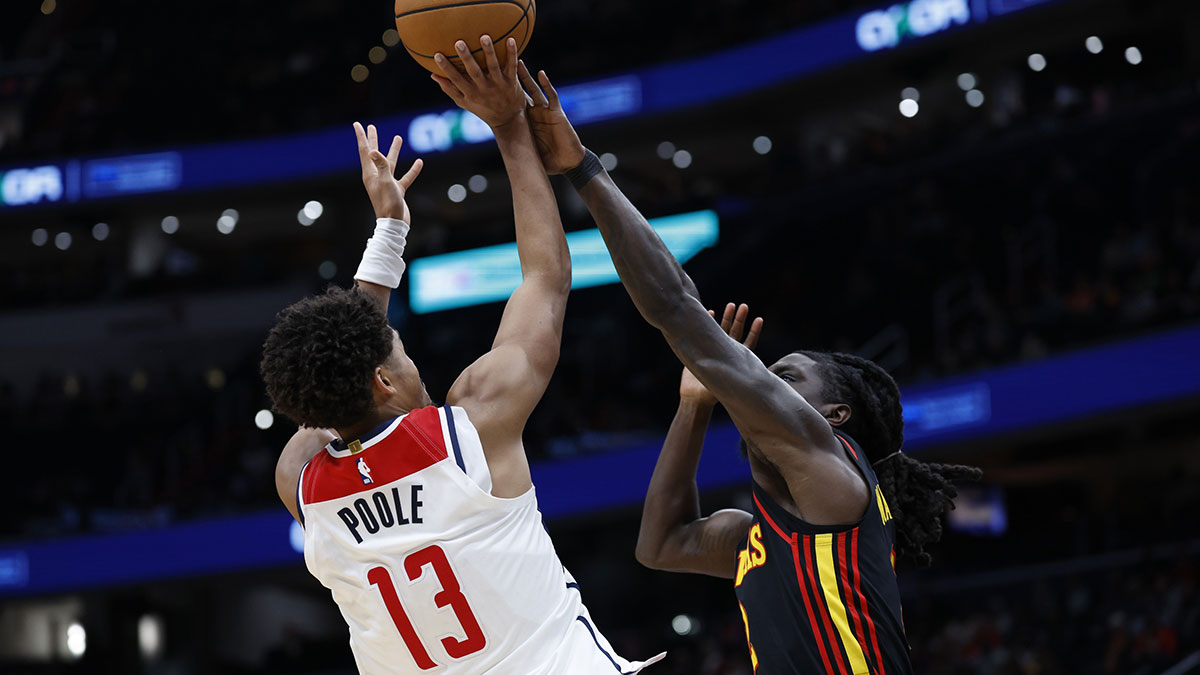 Washington Wizards guard Jordan Poole (13) shoots the ball over Atlanta Hawks guard Keaton Wallace (2) in the second half at Capital One Arena.