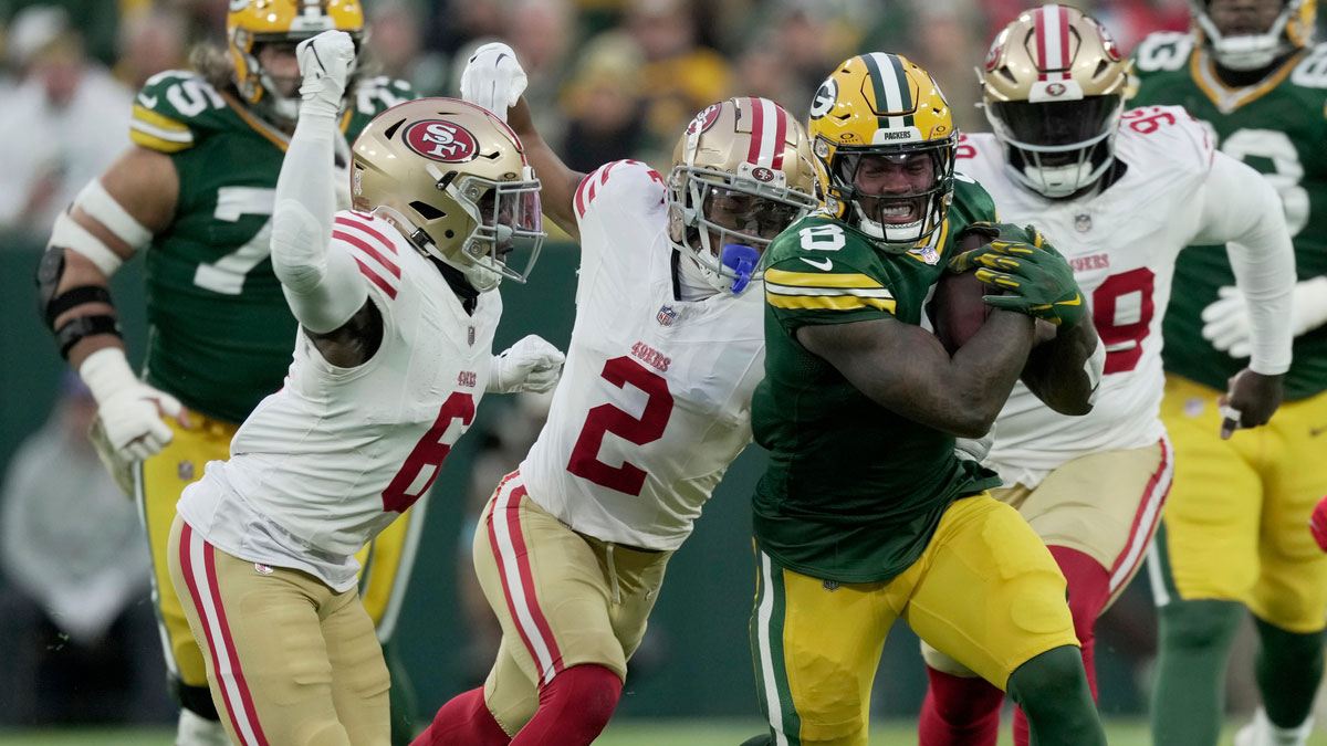 Green Bay Packers running back Josh Jacobs (8) runs for 18 yards during the first quarter of their game against the Sam Francisco 49ers Sunday, November 24, 2024 at Lambeau Field in Green Bay, Wisconsin.