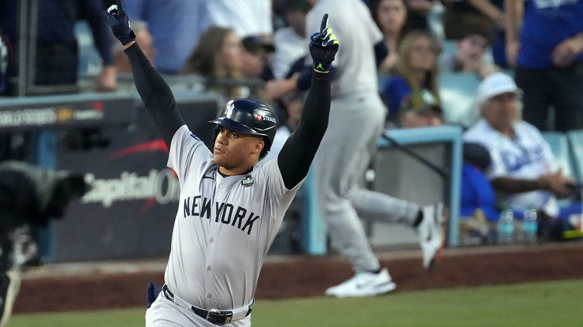 New York Yankees outfielder Juan Soto (22) reacts after hitting a home run against the Los Angeles Dodgers in the third inning for game two of the 2024 MLB World Series at Dodger Stadium.