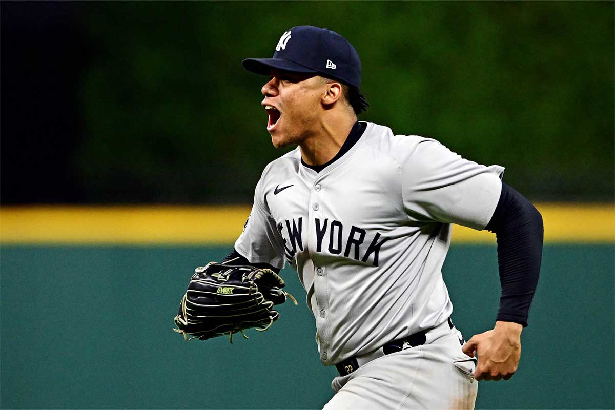 New York Yankees outfielder Juan Soto (22) celebrates after making the final out to beat the Cleveland Guardians during game five of the ALCS for the 2024 MLB playoffs at Progressive Field.