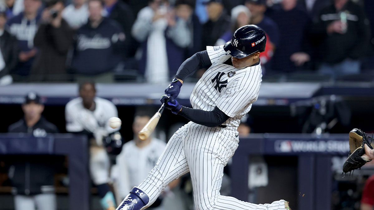 New York Yankees outfielder Juan Soto (22) doubles during the eighth inning against the Los Angeles Dodgers in game four of the 2024 MLB World Series at Yankee Stadium.