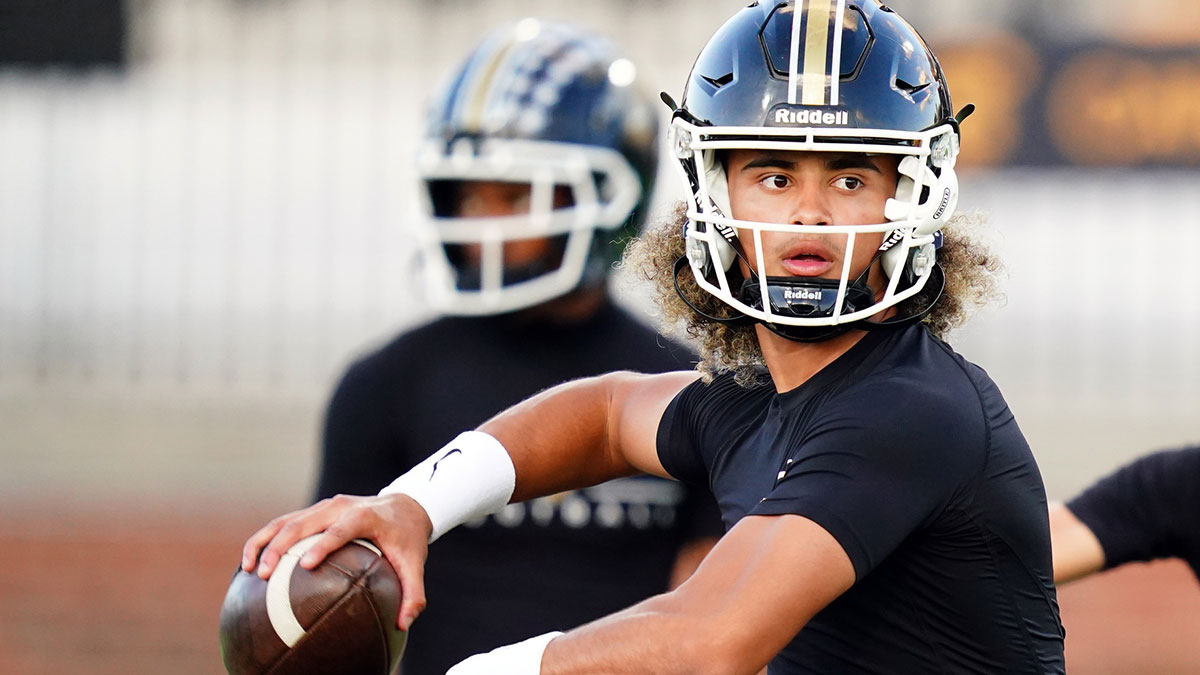 Carrollton Trojans quarterback Julian Lewis (10) runs through drills during warmups before their game against the Westlake Lions at Grisham Stadium. The 15-year-old Carrollton High student has already committed to playing for the University of Southern California Trojans and has been considered one of the top high school quarterback prospects.