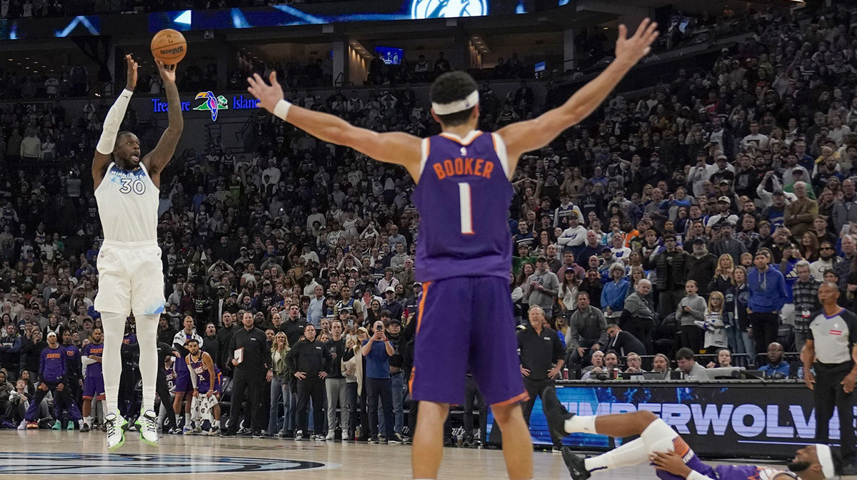 Minnesota Timberwolves forward Julius Randle (30) hits a game-winning three-pointer against the Phoenix Suns as time expires in the fourth quarter at Target Center.