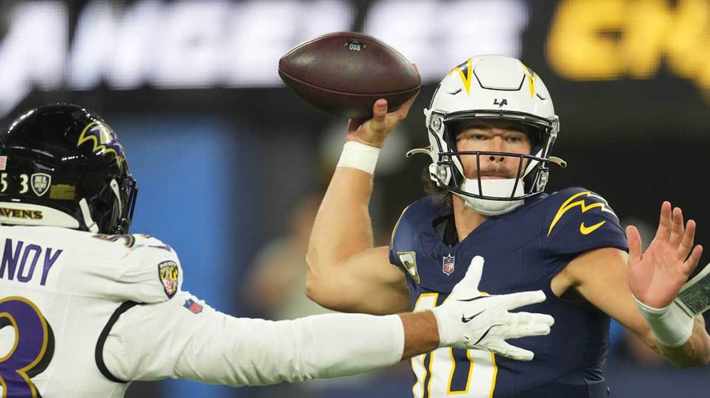 Los Angeles Chargers quarterback Justin Herbert (10) throws the ball against Baltimore Ravens linebacker Kyle Van Noy (53) in the first half at SoFi Stadium.