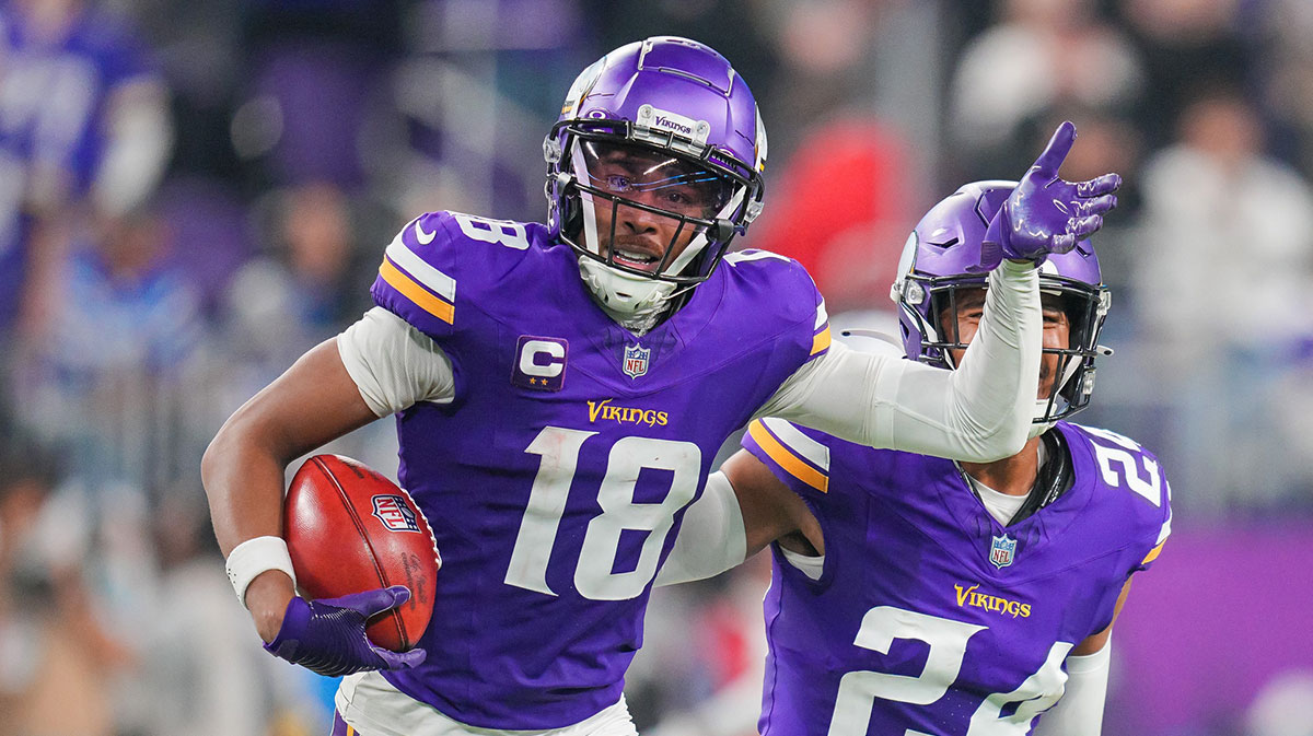 Minnesota Vikings wide receiver Justin Jefferson (18) celebrates catching the onside kick against the Indianapolis Colts in the fourth quarter at U.S. Bank Stadium.