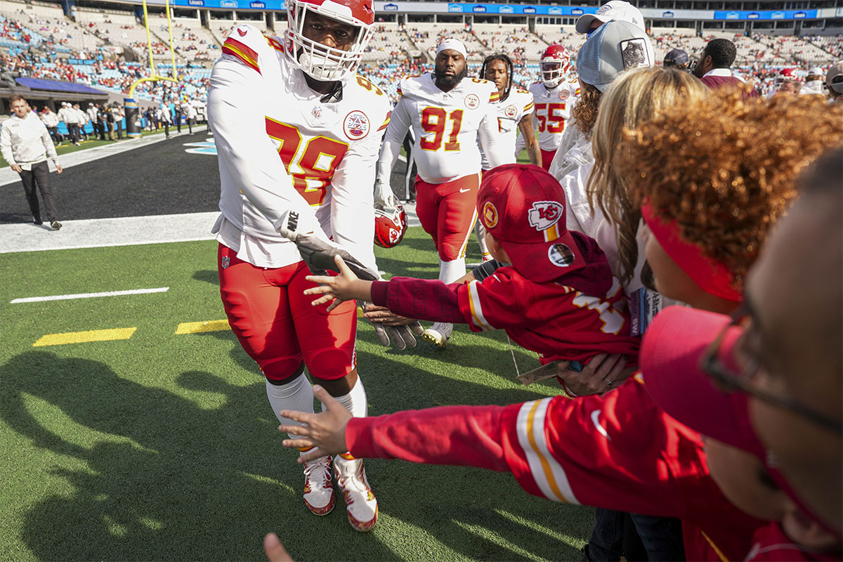 Kansas City Chiefs defensive tackle Tershawn Wharton (98) and teammates high five fans during the first quarter against the Carolina Panthers at Bank of America Stadium.