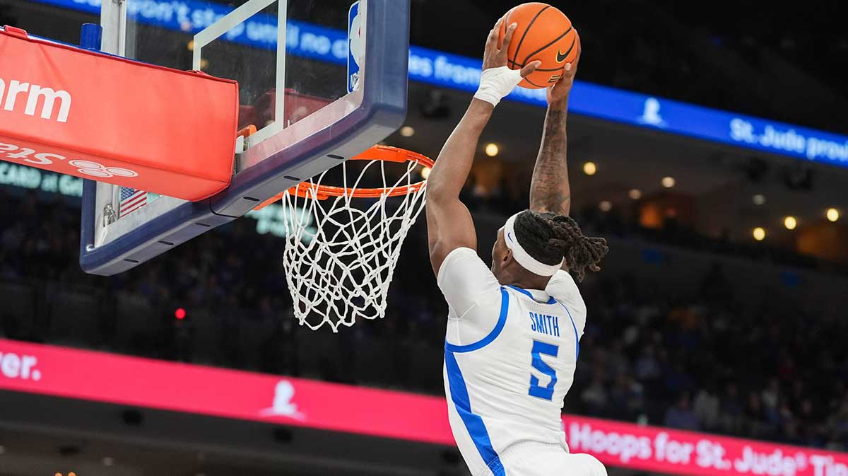 Memphis' Tyreek Smith (5) dunks the ball during the game between UNC and Memphis in the Hoops for St. Jude Tip Off Classic at FedExForum on Tuesday, October 15, 2024.