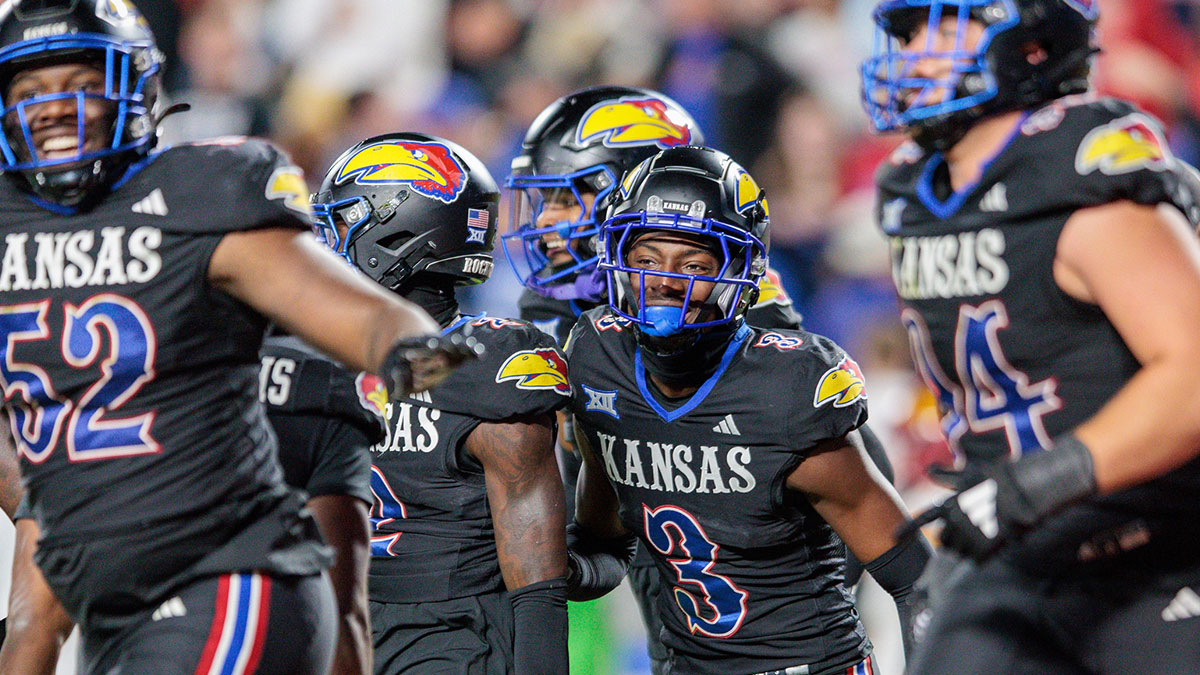 Kansas Jayhawks cornerback Mello Dotson (3) celebrates after scoring a touch down during the fourth quarter against the Iowa State Cyclones at GEHA Field at Arrowhead Stadium.