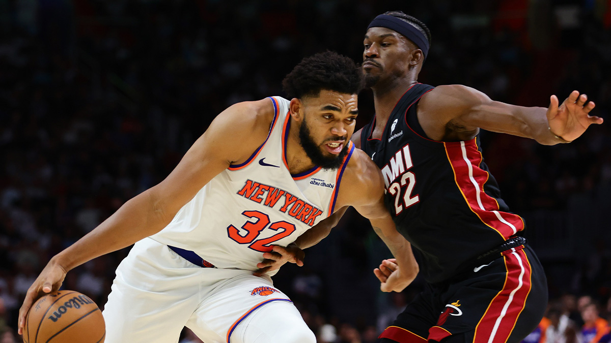 New York Knicks center Karl-Anthony Towns (32) drives to the basketball against Miami Heat forward Jimmy Butler (22) during the fourth quarter at Kaseya Center.