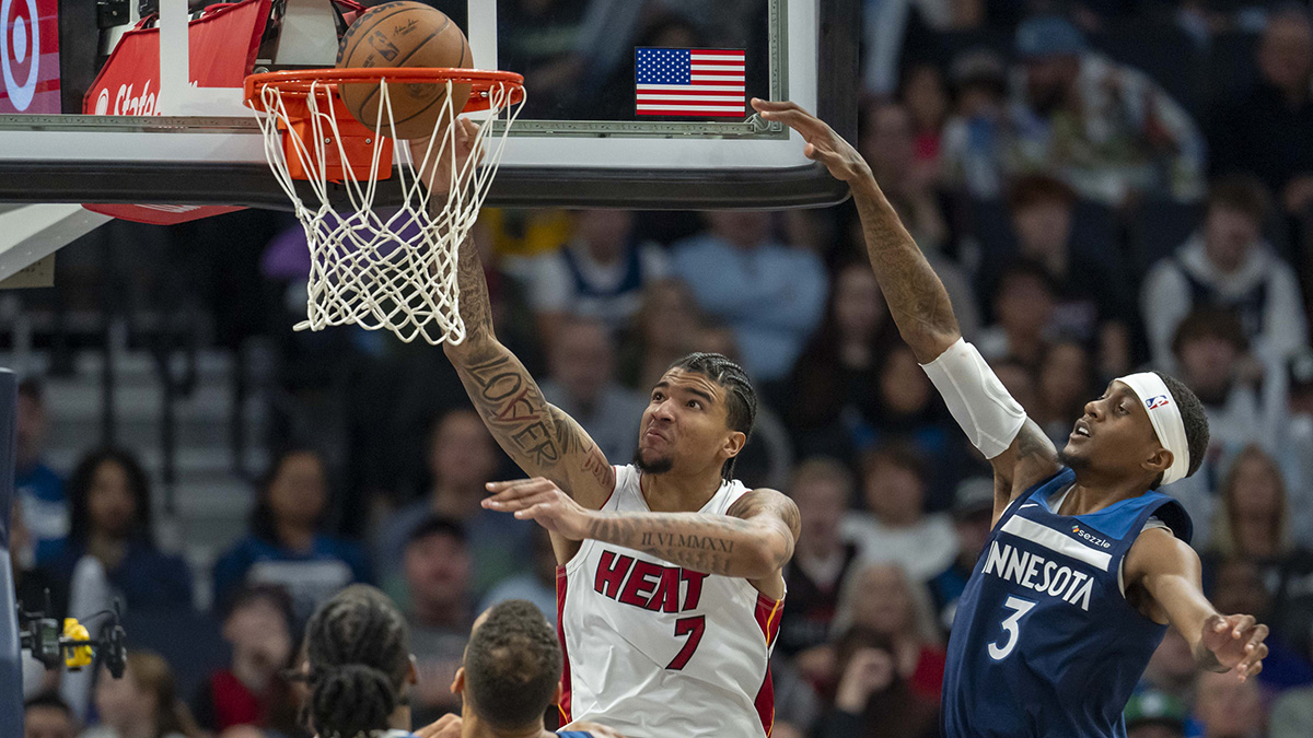 Minnesota Timberwolves guard Anthony Edwards (5) drives to the basket past Miami Heat forward Haywood Highsmith (24) in the first half at Target Center.