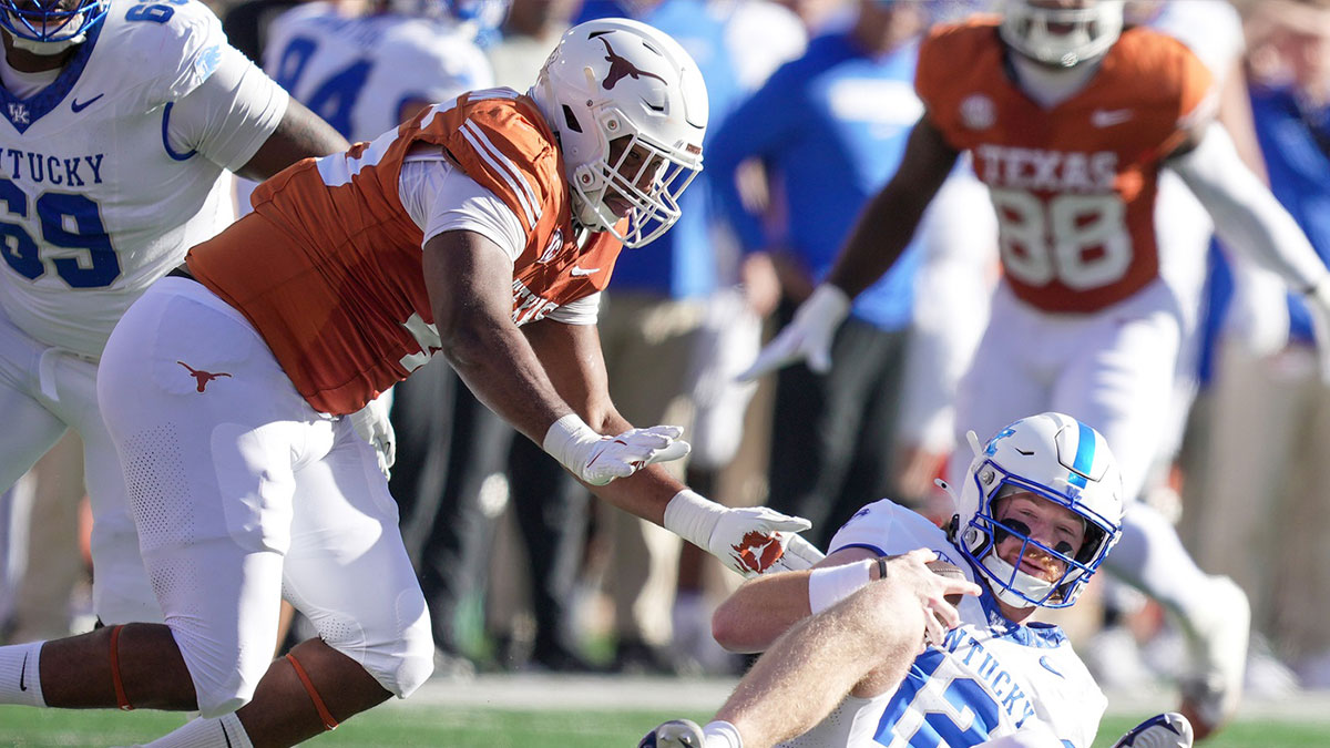 Texas Longhorns defensive lineman Vernon Broughton (45) sacks Kentucky Wildcats quarterback Brock Vandagriff (12) in the first quarter at Darrell K Royal Texas Memorial Stadium.