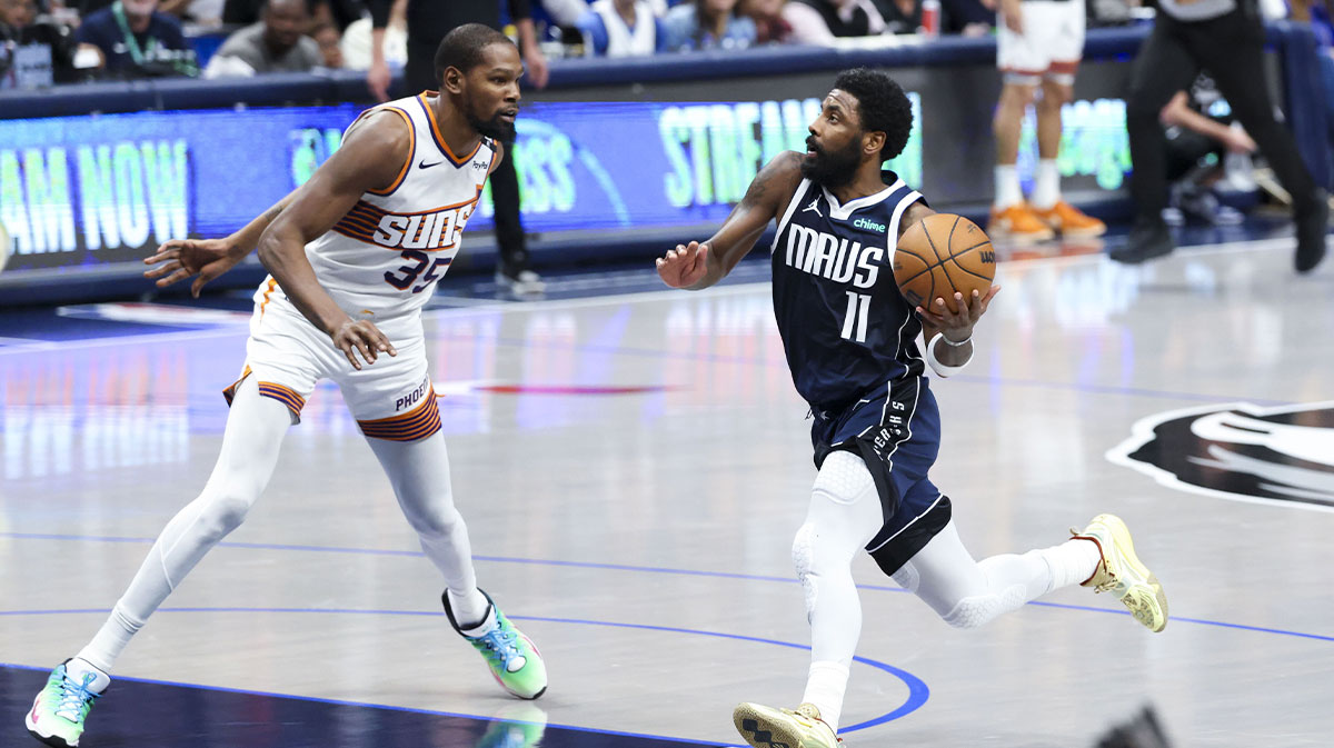 Dallas Mavericks guard Kyrie Irving (11) drives to the basket as Phoenix Suns forward Kevin Durant (35) defends during the fourth quarter at American Airlines Center. Charles Barkley praised former coach Kenny Atkinson while blaming Durant and Irving for imploding the promising Nets team from 2019-2022.