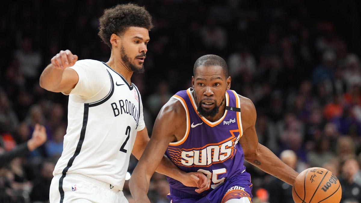 Phoenix Suns forward Kevin Durant (35) drives against Brooklyn Nets forward Cameron Johnson (2) during the first half at Footprint Center