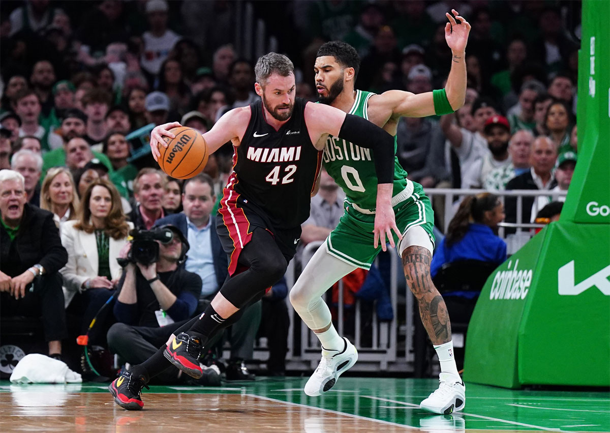 Boston Celtics forward Jayson Tatum (0) defends against Miami Heat forward Kevin Love (42) in the second quarter during game two of the first round of the 2024 NBA Playoffs at TD Garden.