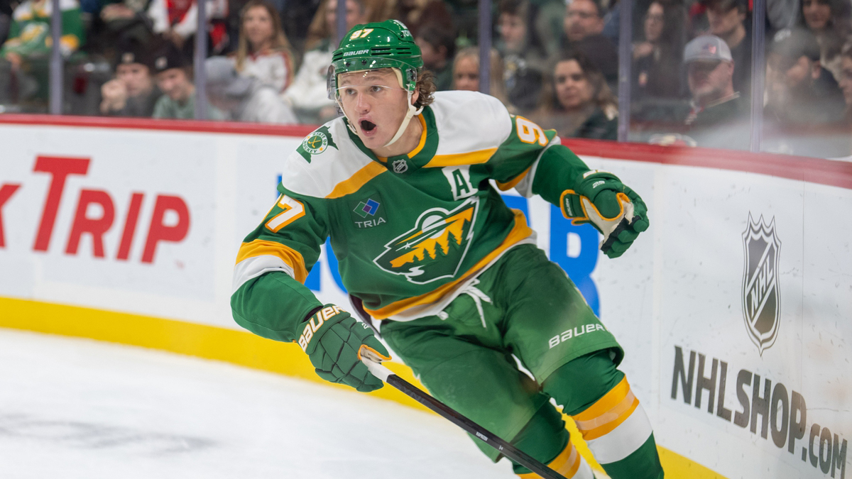 Minnesota Wild left wing Kirill Kaprizov (97) brings the puck up ice against the Dallas Stars in the third period at Xcel Energy Center.