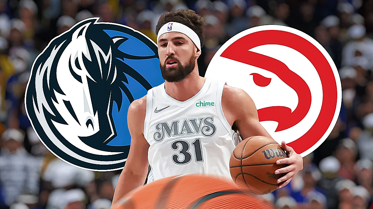 Mavericks Klay Thompson looking serious with Dallas Mavericks and Atlanta Hawks logos in background.