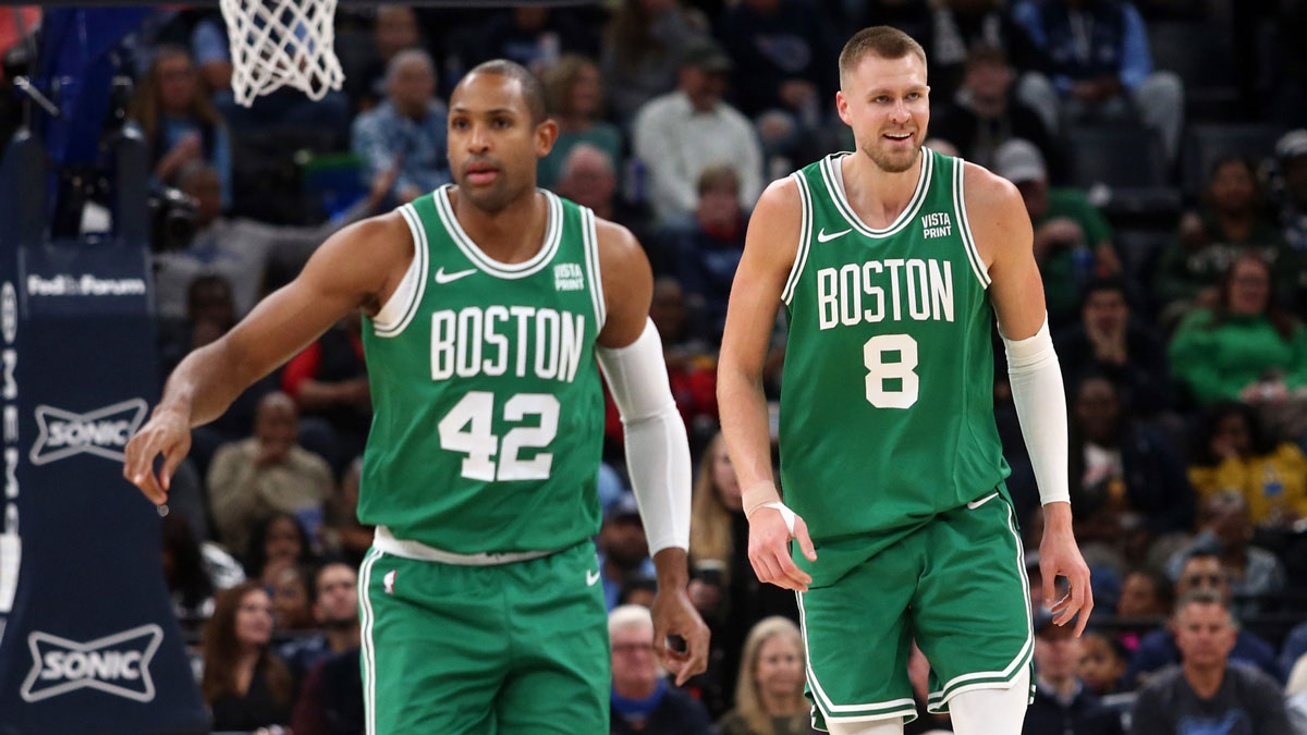 Boston Celtics center Al Horford (42) and center Kristaps Porzingis (8) get back on defense during the first half against the Memphis Grizzlies at FedExForum.