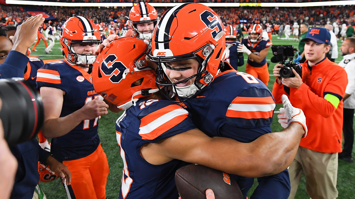 Syracuse football quarterback Kyle McCord (right) celebrates with tight end Jamie Tremble (left) following a game against the Miami Hurricanes at the JMA Wireless Dome.