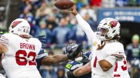 Kyler Murray (1) passes against the Seattle Seahawks during the first quarter at Lumen Field
