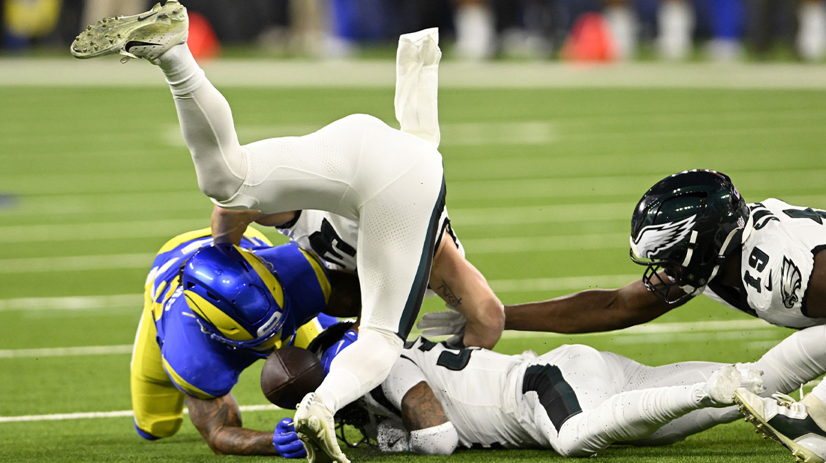 Los Angeles Rams running back Kyren Williams (23) fumbles next to Philadelphia Eagles cornerback Cooper DeJean (second from left), recovered by the Eagles during the first half at SoFi Stadium.