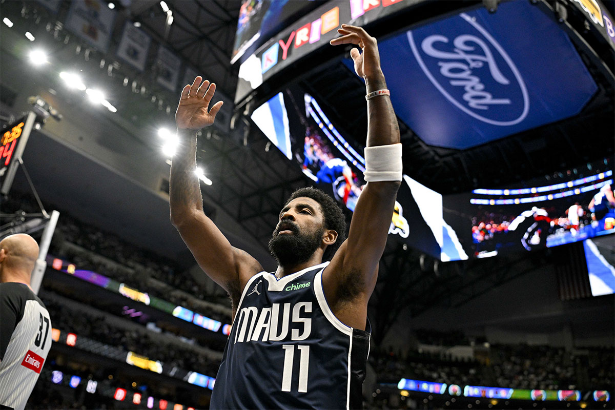 Dallas Mavericks guard Kyrie Irving (11) motions for the ball during the first quarter against the New Orleans Pelicans at the American Airlines Center.