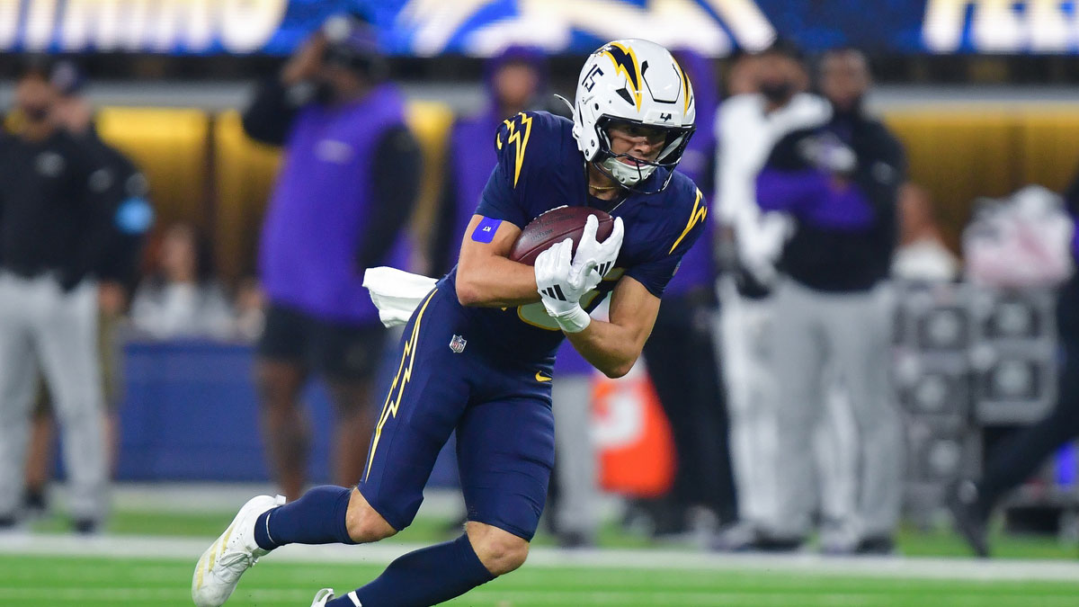 Los Angeles Chargers wide receiver Ladd McConkey (15) runs the ball against the Baltimore Ravens during the second half at SoFi Stadium.