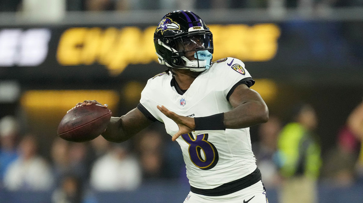 Baltimore Ravens quarterback Lamar Jackson (8) throws the ball against the Los Angeles Chargers in the first half at SoFi Stadium.