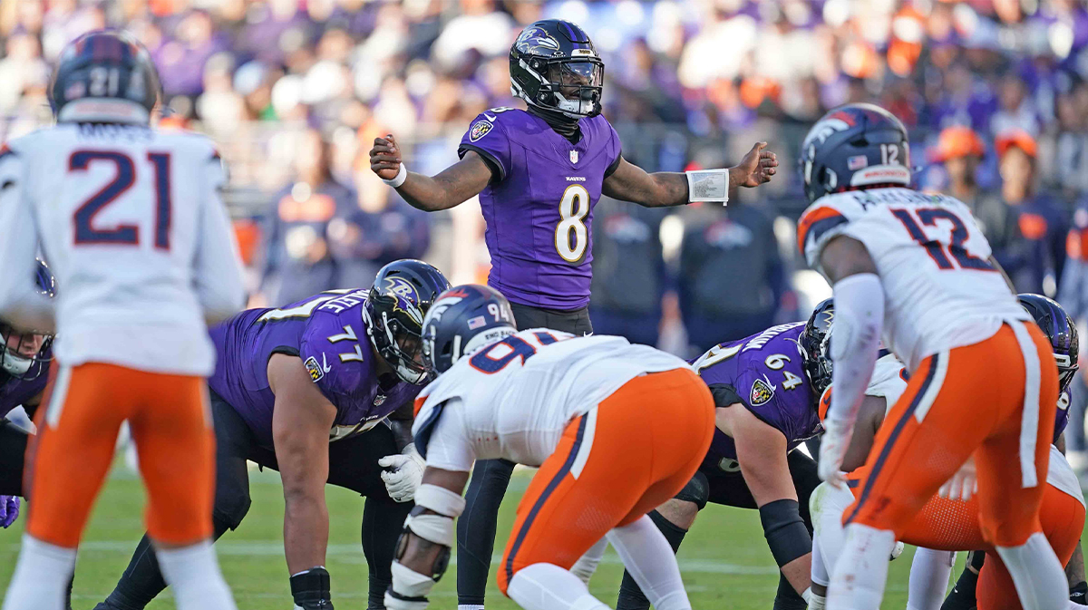 Baltimore Ravens quarterback Lamar Jackson (8) runs the offense during the third quarter against the Denver Broncos at M&T Bank Stadium.