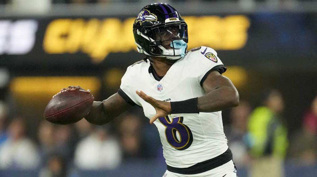 Baltimore Ravens quarterback Lamar Jackson (8) throws the ball against the Los Angeles Chargers in the first half at SoFi Stadium.