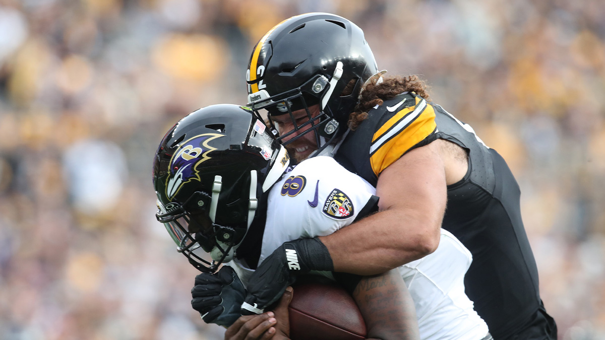 Pittsburgh Steelers defensive tackle Isaiahh Loudermilk (92) raps up Baltimore Ravens quarterback Lamar Jackson (8) during the second quarter at Acrisure Stadium.