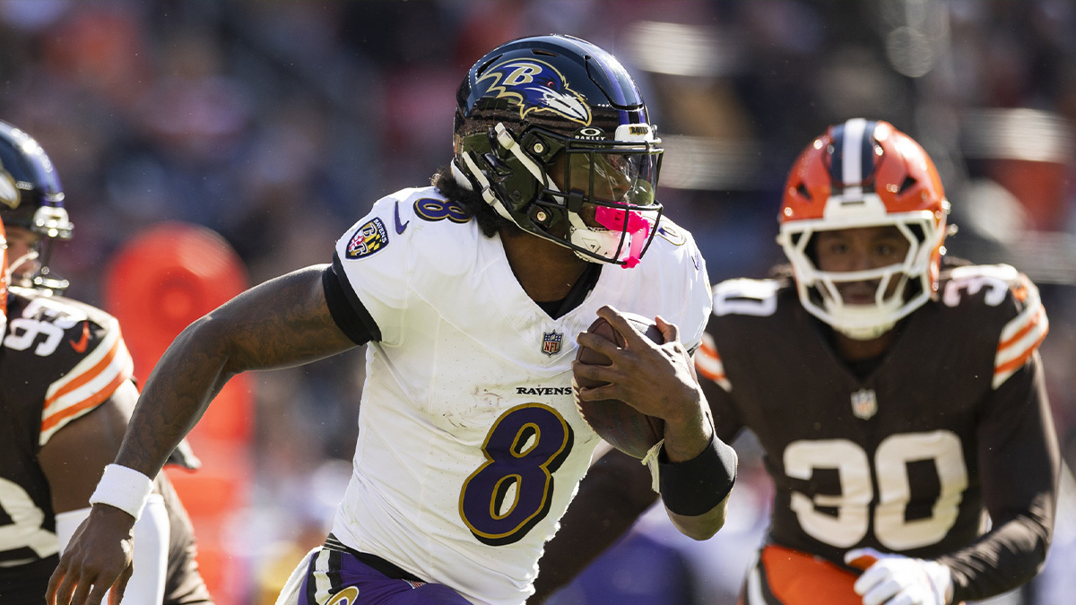 Baltimore Ravens quarterback Lamar Jackson (8) runs the ball against the Cleveland Browns during the second quarter at Huntington Bank Field.