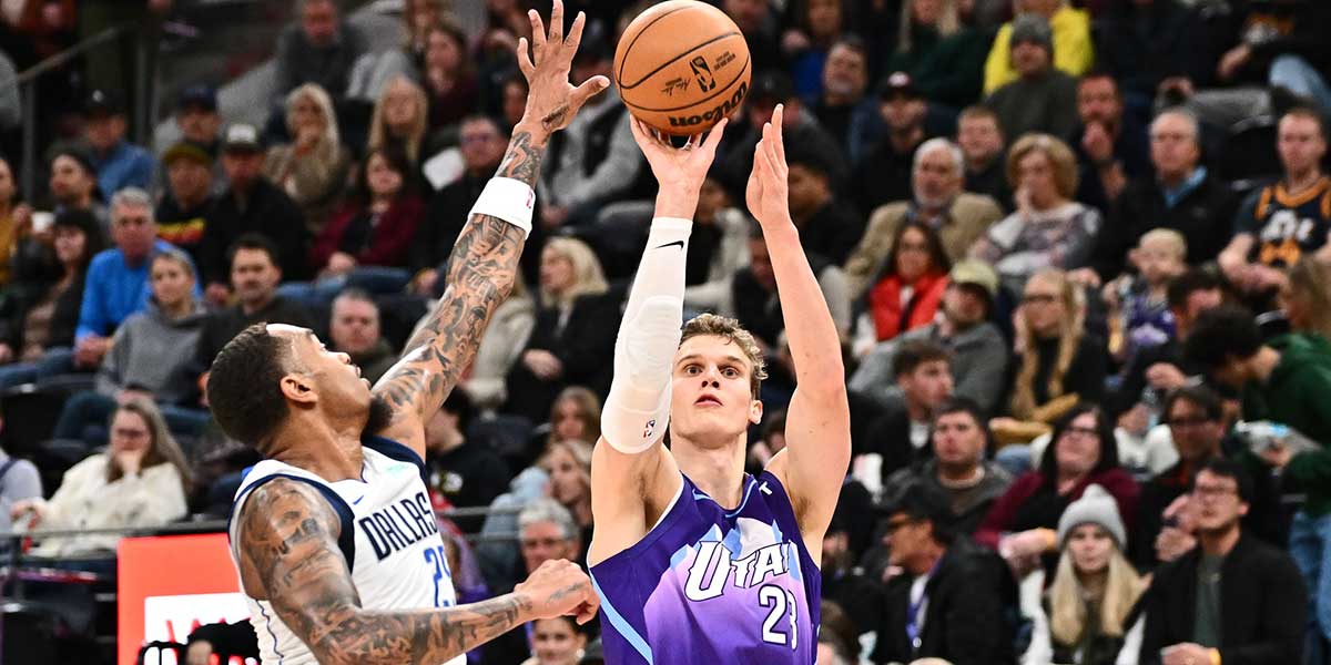 Utah Jazz forward Lauri Markkanen (23) shoots over Dallas Mavericks forward P.J. Washington (25) in the second half at Delta Center