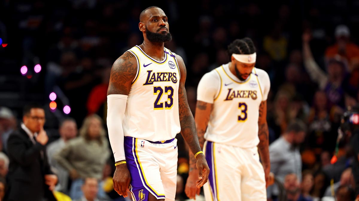 Los Angeles Lakers forward LeBron James (23) and forward Anthony Davis (3) walk off the court during the second quarter against the Phoenix Suns at Footprint Center. 