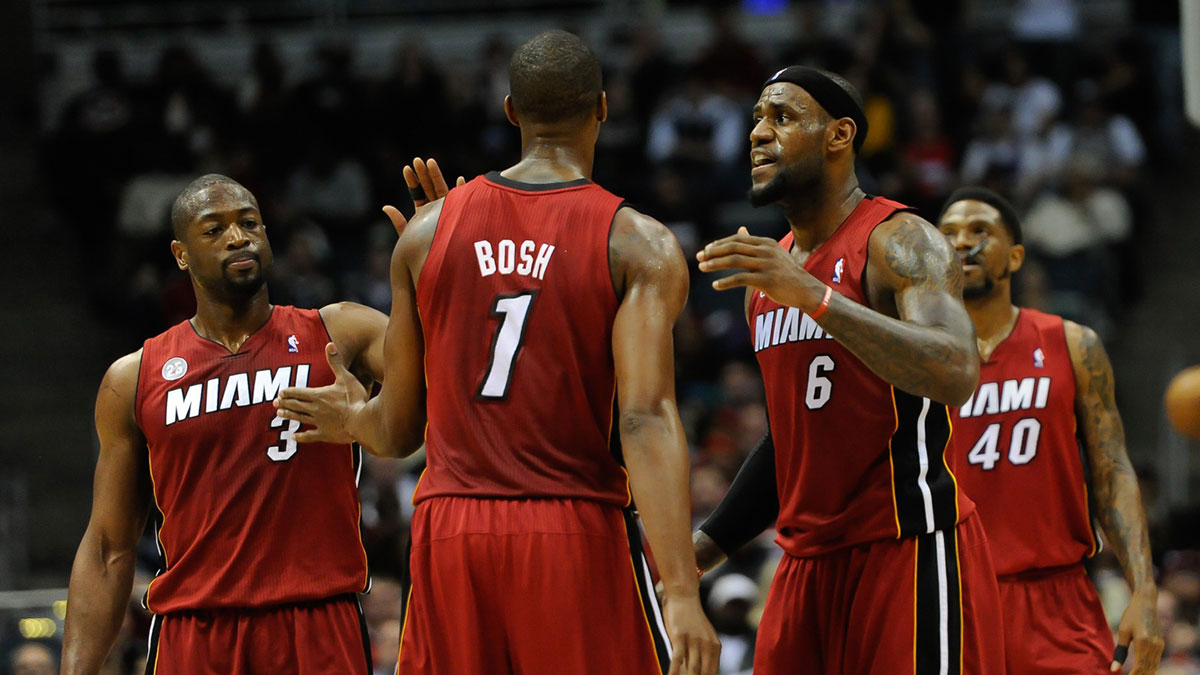 Miami Heat forward LeBron James (6) reacts with center Chris Bosh (1) and guard Dwyane Wade (3) after a Heat basket during the game against the Milwaukee Bucks at the Bradley Center. The Heat beat the Bucks 107-94.