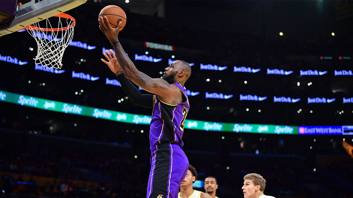 Los Angeles Lakers forward LeBron James (23) scores a basket against the against the Utah Jazz during the first half of their NBA Cup group stage matchup at Crypto.com Arena.