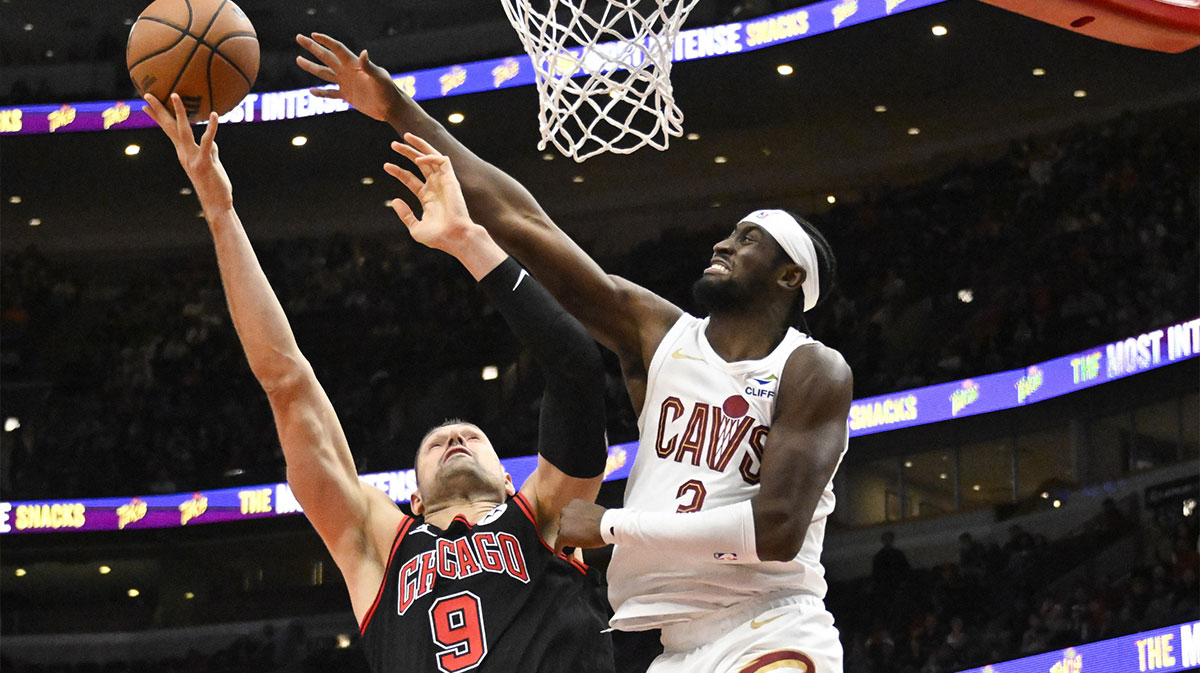 Chicago Bulls center Nikola Vucevic (9) shoots against Cleveland Cavaliers guard Caris LeVert (3) during the second half at United Center.