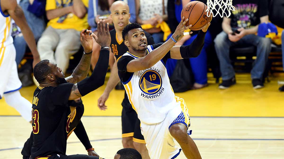 Gold state warriors Guard Leandro Barbosa (19) shoot the ball against Cleveland Cavaliers forward Lebron James (23) during the second quarter in the game of seven of the NBA finals in Oracle Arena.