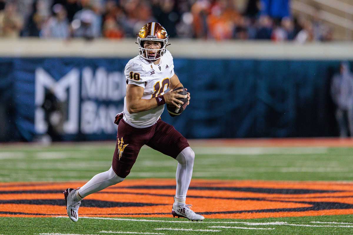 Arizona State Sun Devils quarterback Sam Leavitt (10) scrambles in the back field during the fourth quarter against the Oklahoma State Cowboys at Boone Pickens Stadium. 