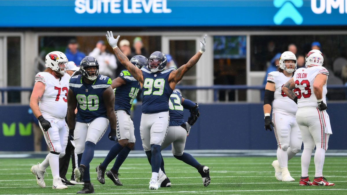 Seattle Seahawks defensive tackle Jarran Reed (90) and defensive end Leonard Williams (99) celebrate after a defensive play against the Arizona Cardinals during the first half at Lumen Field.